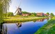 Landschaftsmotiv aus dem ländlichen Niedersachsen mit Kanal und Windmühle